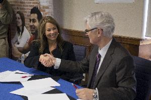 From left: Nina Nichols, president, Resolution Research and UOIT President Tim McTiernan, at the MOU signing.